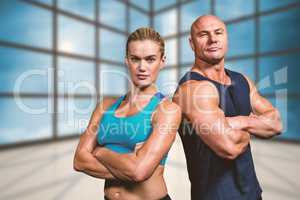 Composite image of portrait of confident strong man and woman