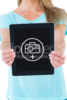 Composite image of mid section of woman showing a tablet pc