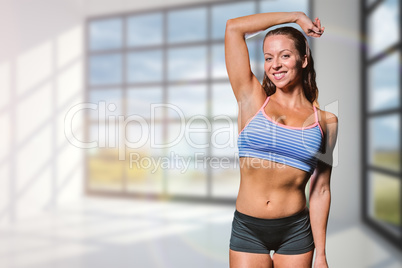 Composite image of portrait of happy female athlete with hand on