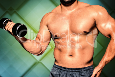 Composite image of mid section of a bodybuilder with dumbbell