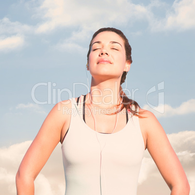Composite image of fit woman in the sun