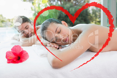 Composite image of couple lying on massage table at spa center