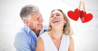 Composite image of happy couple laughing together