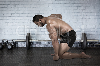 Composite image of muscular man flexing for camera