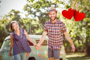 Composite image of hipster couple having fun together