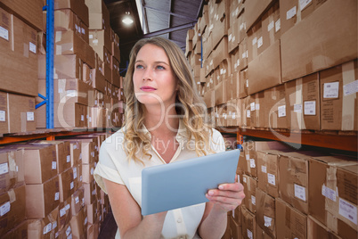 Composite image of woman using tablet pc