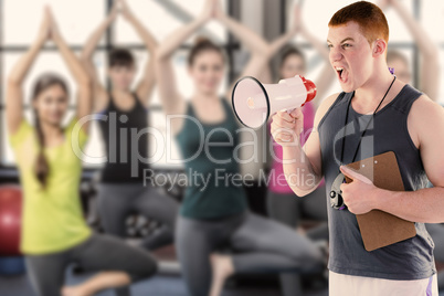 Composite image of angry personal trainer yelling through megaph