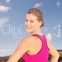 Composite image of smiling fit woman