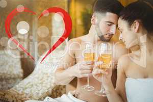 Composite image of romantic couple together with champagne glass