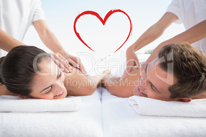 Composite image of peaceful couple enjoying couples massage pool