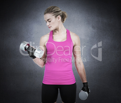 Composite image of muscular woman exercising with dumbbells