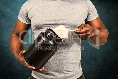 Composite image of fit man scooping protein powder