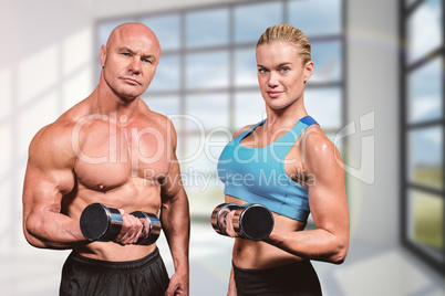 Composite image of portrait of muscular man and woman lifting du