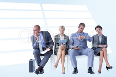 Composite image of business people waiting to be called into int