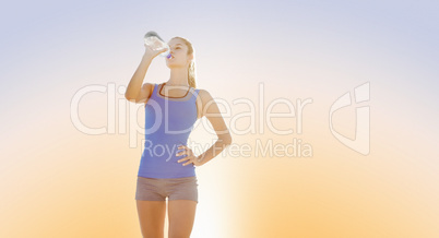 Composite image of fit woman with water