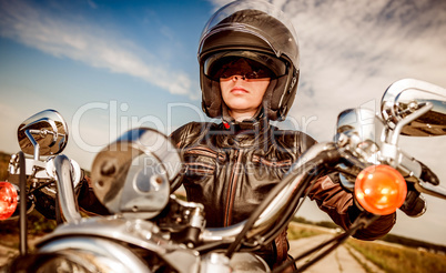 Biker girl on a motorcycle