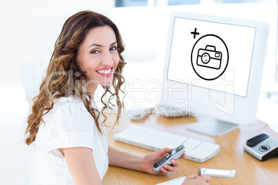 Composite image of smiling businesswoman looking at camera