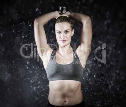 Composite image of muscular woman lifting heavy dumbbells