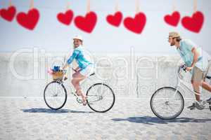 Composite image of cute couple on a bike ride