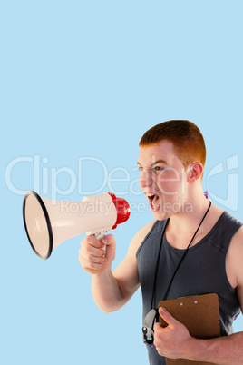 Composite image of angry personal trainer yelling through megaph