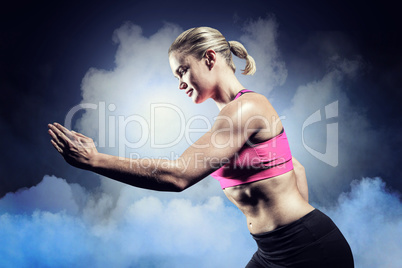 Composite image of muscular woman running in sportswear