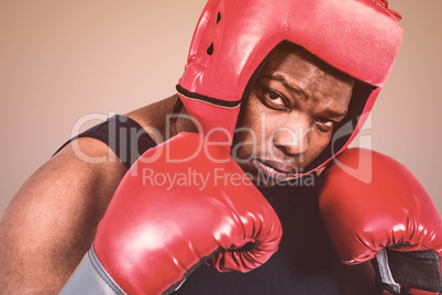 Composite image of fit man boxing with gloves