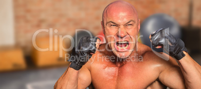 Composite image of angry fighter with gloves