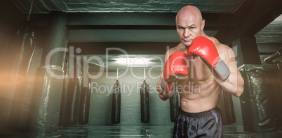 Composite image of portrait of boxer with gloves