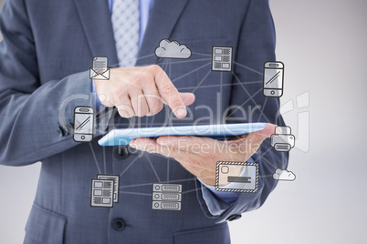 Composite image of businessman using tablet pc Composite image of businessman using tablet pc