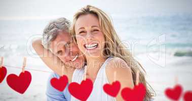 Composite image of happy couple laughing together