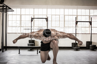 Composite image of muscular man flexing for camera