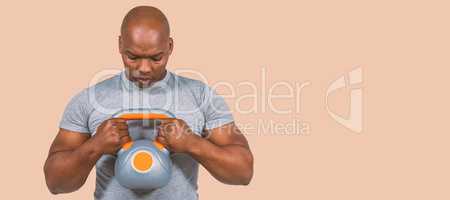 Composite image of fit man exercising with kettlebell