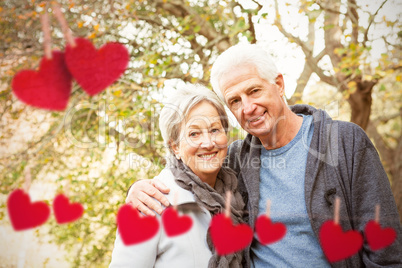 Composite image of senior couple in the park