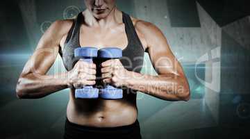 Composite image of muscular woman lifting heavy dumbbells