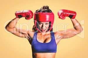 Composite image of portrait of angry female boxer flexing muscle