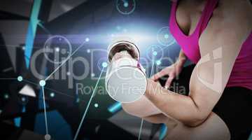 Composite image of muscular woman exercising with dumbbells