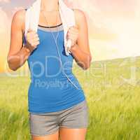 Composite image of fit woman with towel