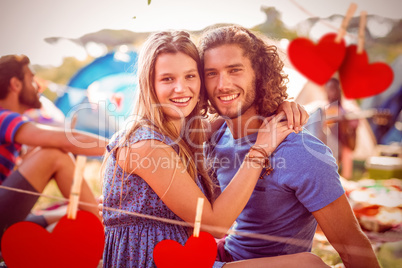 Composite image of hipster couple smiling at camera Composite image of hipster couple smiling at camera