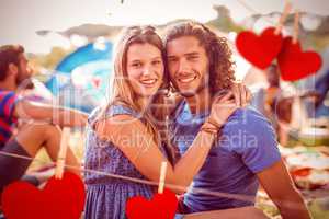 Composite image of hipster couple smiling at camera