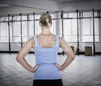 Composite image of back view of muscular woman