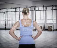 Composite image of back view of muscular woman
