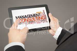 business man pointing to a tablet pc