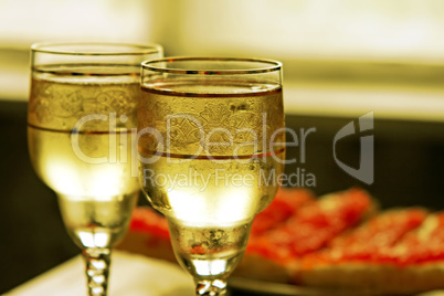 champagne glasses and red caviar