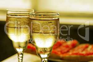 champagne glasses and red caviar