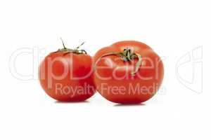 two red tomatoes on white background