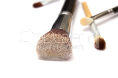 Assorted make up brushes on white background