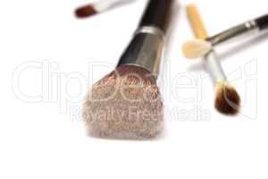 Assorted make up brushes on white background