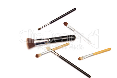 Assorted make up brushes on white background