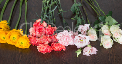 Four different types of flowers on the table