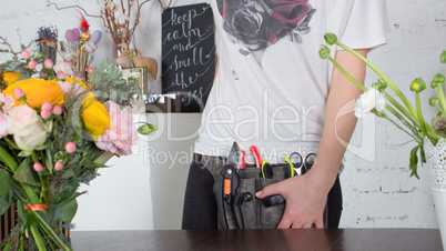 Close view of florist's belt with tools